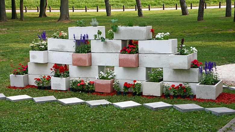 Visually appealing wall of flowers in a concrete blocks