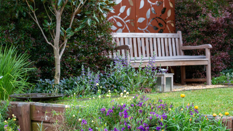Corten steel privacy fence panel in a garden