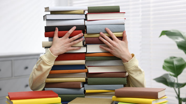 holding many books