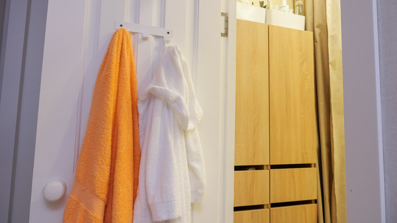 A door with towels hanging on it.