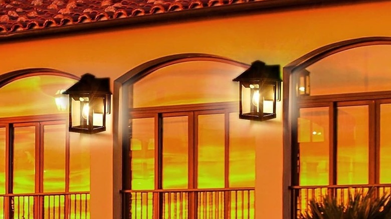 CYHKEE Solar Wall Lanterns attached to side of building