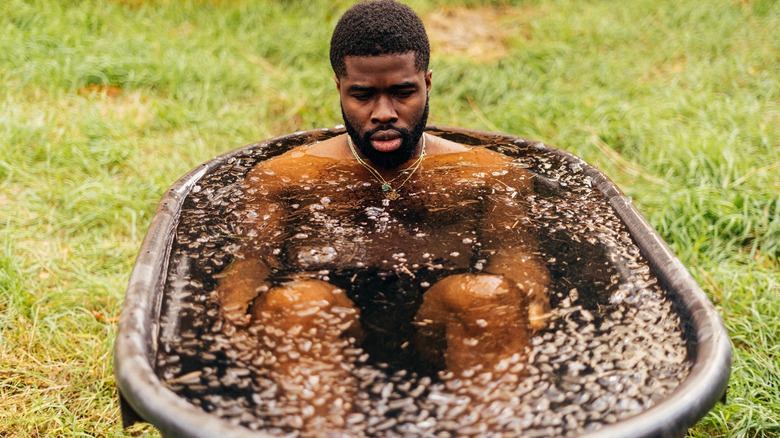 man taking ice bath