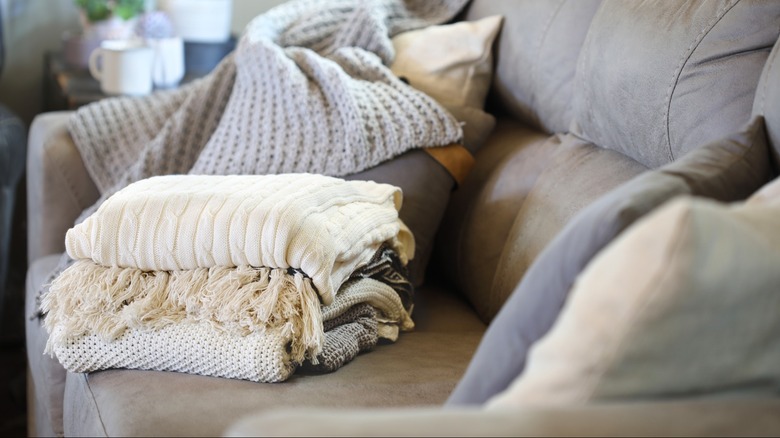 stack of light-colored throws sitting on