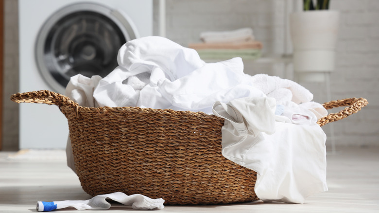 Clothes overflowing out of a laundry basket