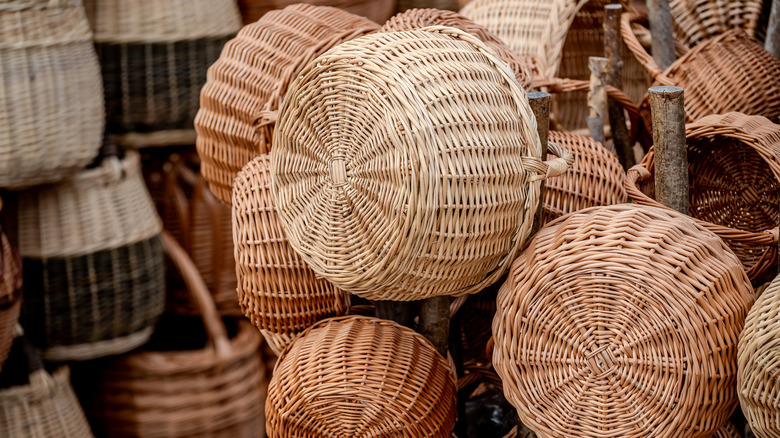 Wicker baskets hanging for sale at a market