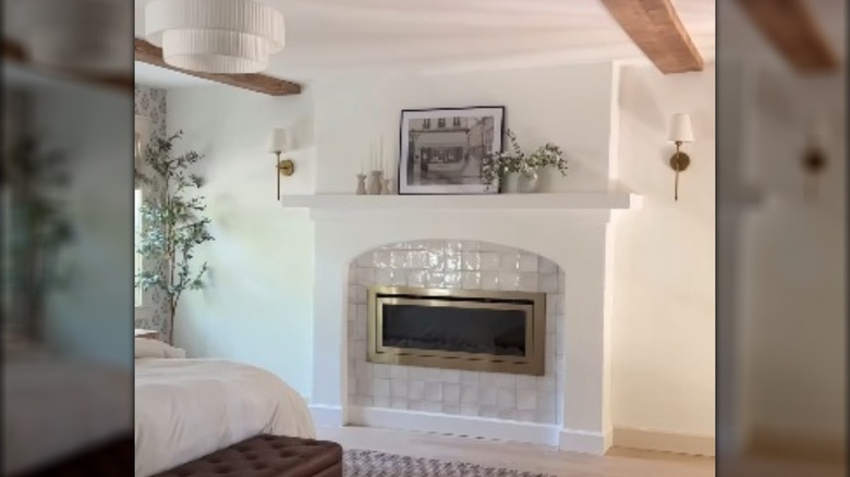 Living room with tiled fireplace surround