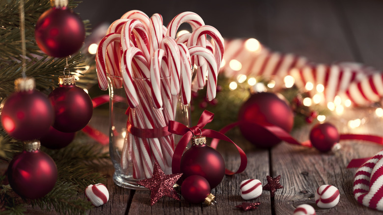 Candy canes on glass vase