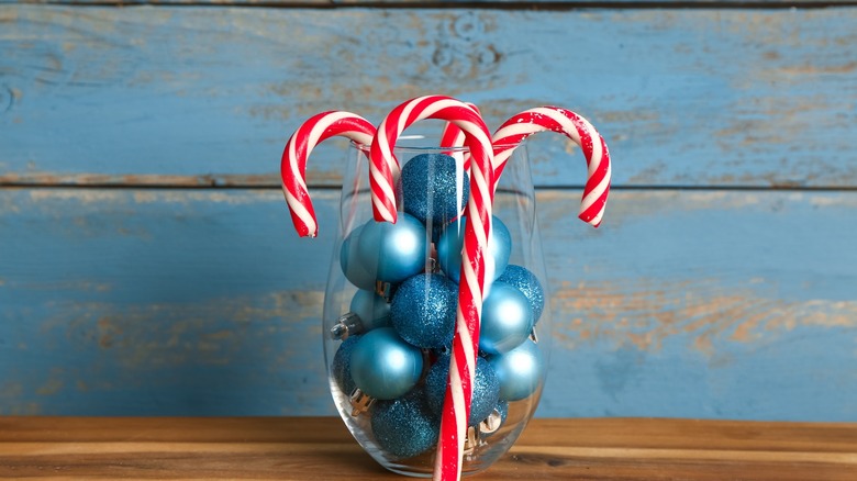 Glass with ornaments and candy canes