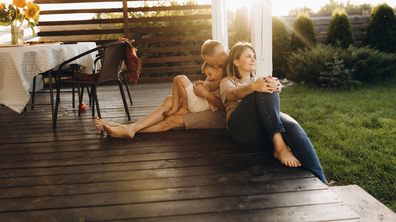 family sitting on floating deck