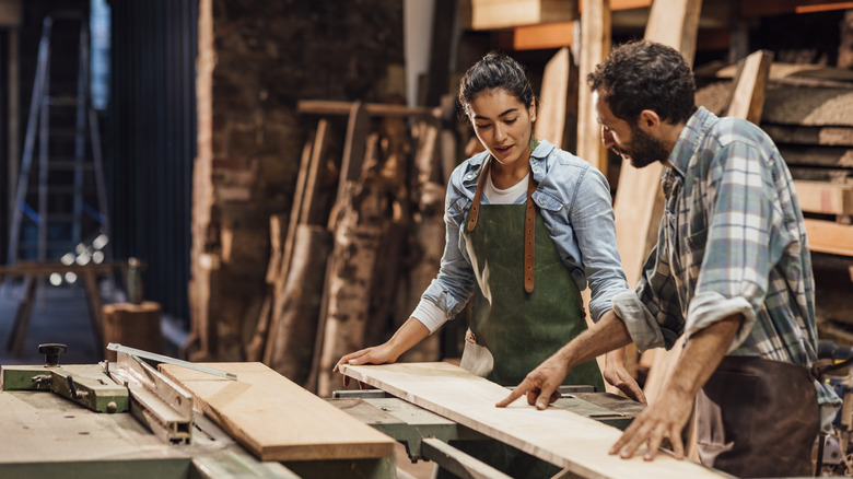 Couple preparing a woodworking project