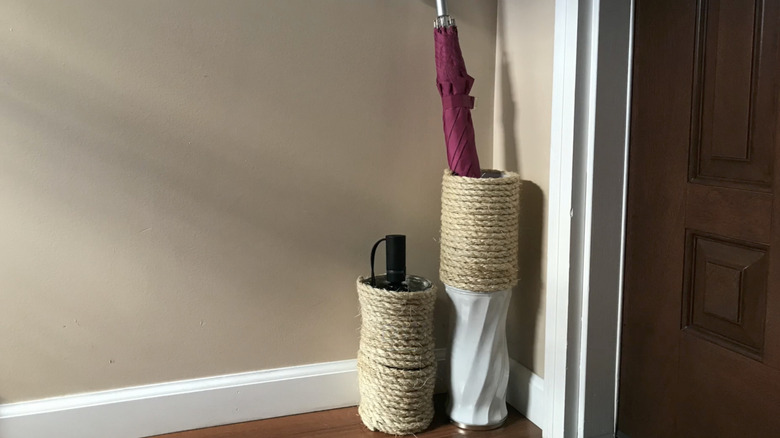 Umbrella holders made out of rope and a vase