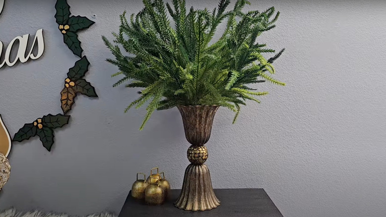 Tarnished DIY Dollar Tree vase holding greenery