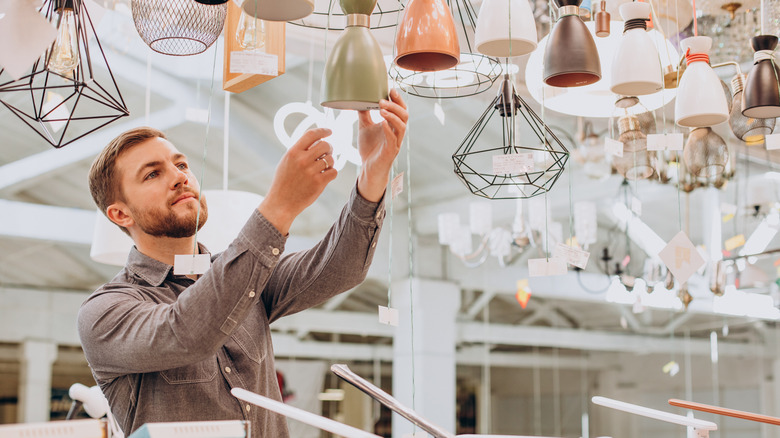 Man shopping for lamps