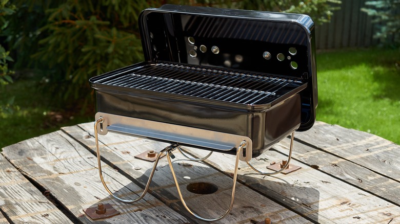 portable BBQ grill on table