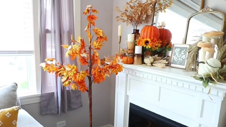 A dupe of the Pottery Barn fall tree in a living room