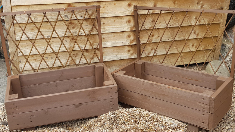 two trellises with planter boxes