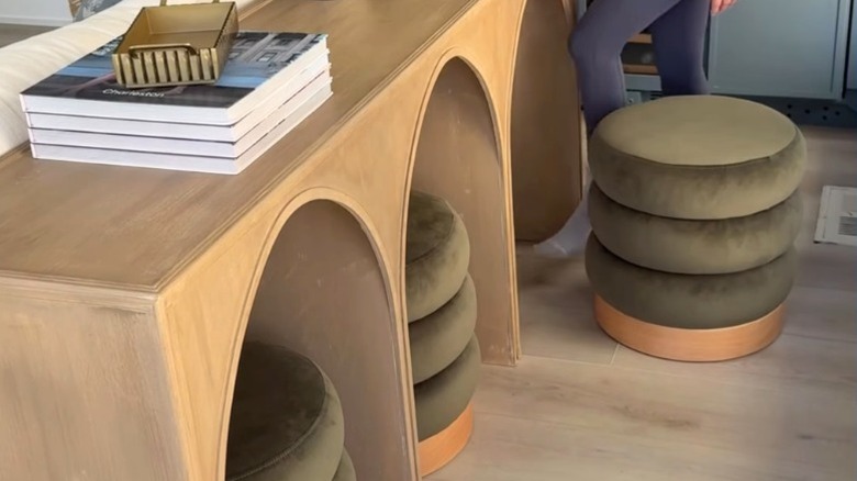 The Arhaus Hattie arched console table with decorative stone on top