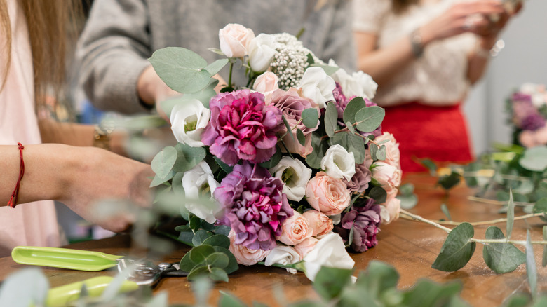 arranging flowers 