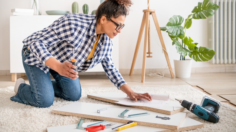woman preparing to assemble products