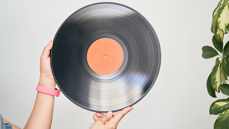Woman holding vinyl record