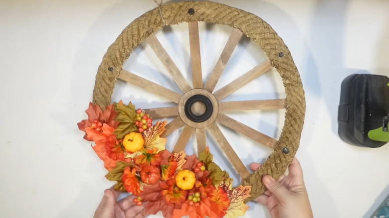 Woman making wagon wheel wreath
