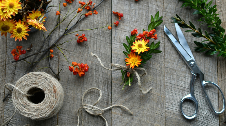 Autumn craft supplies including flowers and twine