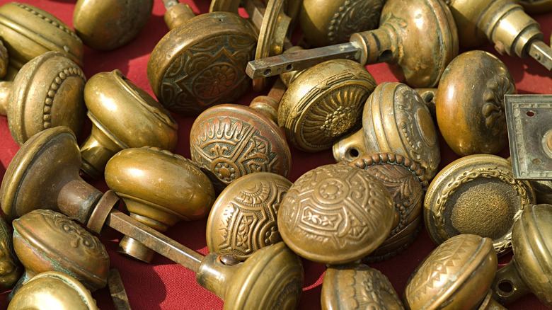bunch of antique brass doorknobs