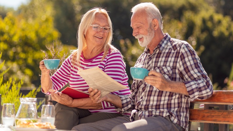 Man and woman sitting outside