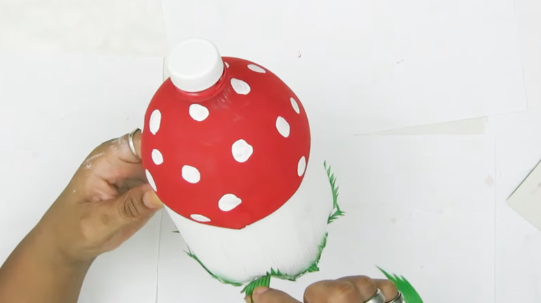 mushroom-themed plastic bird feeder