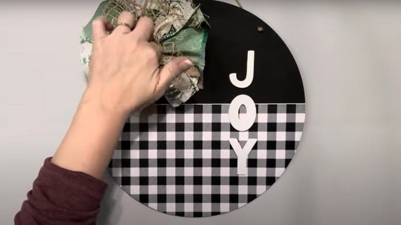 screenshot from video tutorial for creating joy door sign