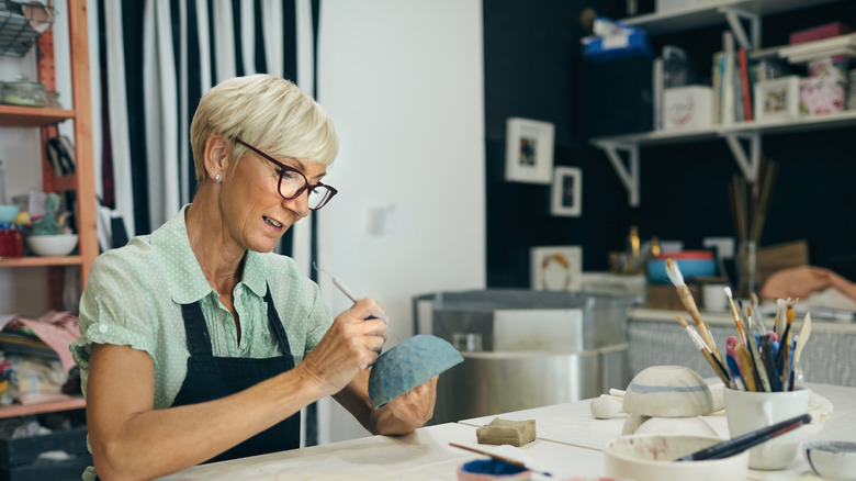 lady painting bowl 