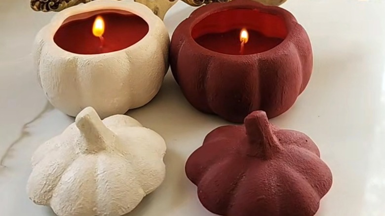 DIY candles made from Dollar Tree ceramic pumpkins with textured paint