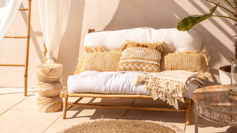 Bamboo patio furniture, upholstery, pillows.