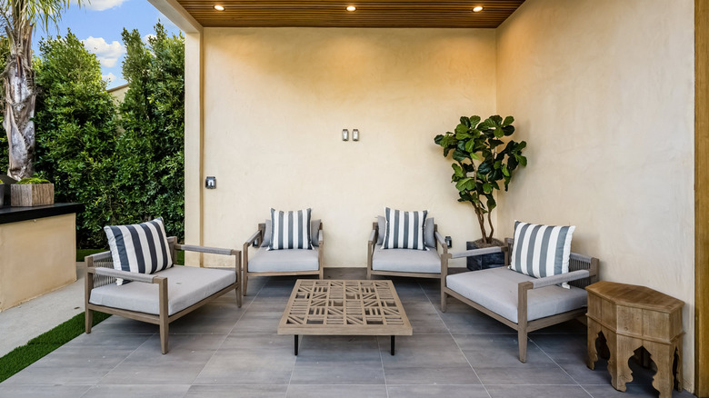outdoor space with seating area and blank walls