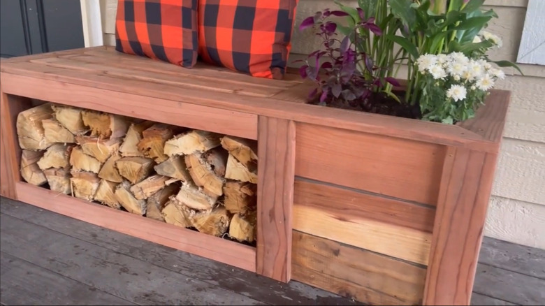 Bench with firewood storage and a planter