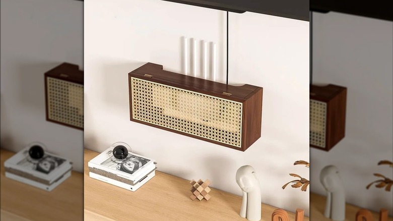 HJAGDJ's rattan router storage box mounted on a wall above a console