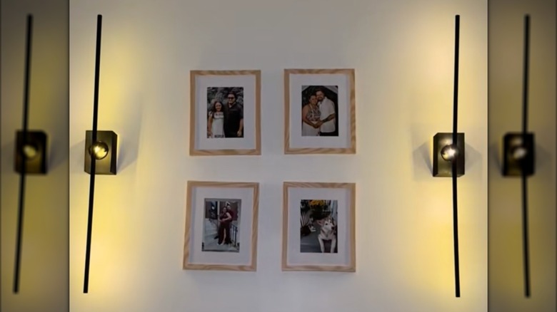 DIY lights illuminate hanging picture frames.