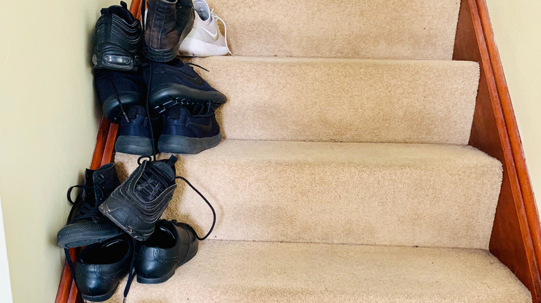 Shoes cluttering a staircase