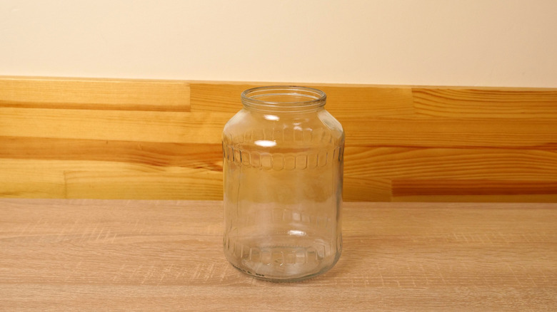 An empty glass jar on a counter