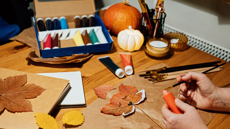 Person creating thanksgiving decor