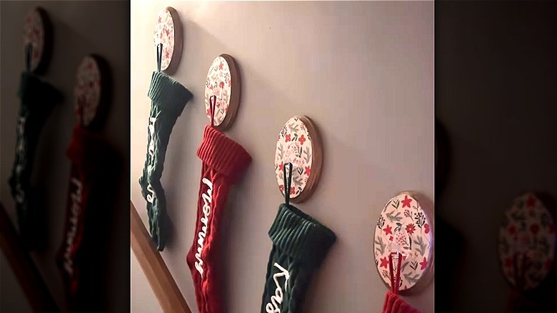 Video tutorial to make wall-mounted stocking hooks from Dollar Tree finds
