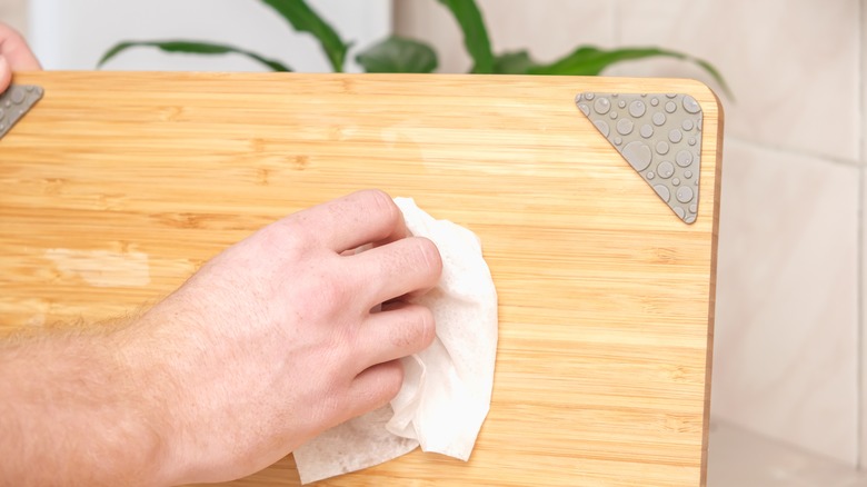 wiping wood cutting board