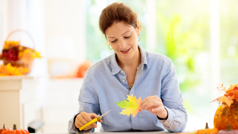 woman making fall decor