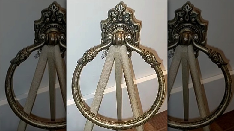 Vintage towel ring repurposed into antique home decor.