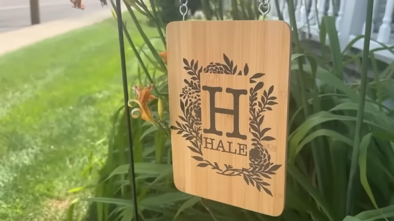 A garden flag made from a Dollar Tree cutting board