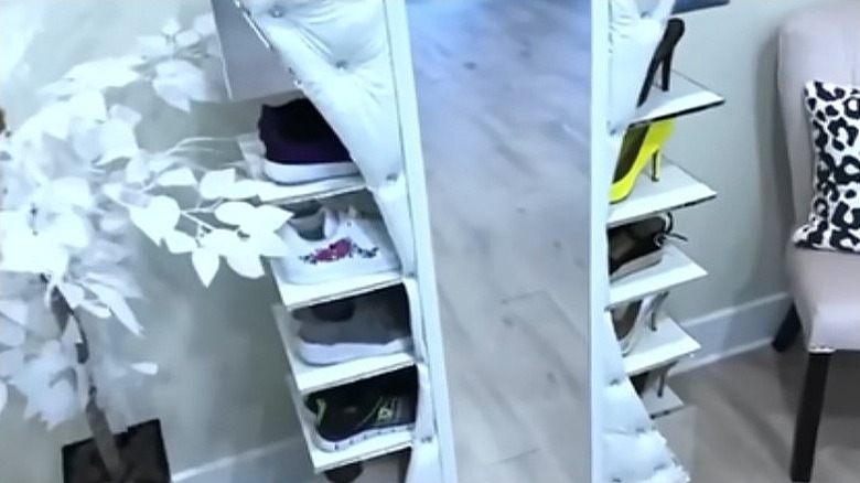 Completed shoe storage rack with embellishments and mirror on the front