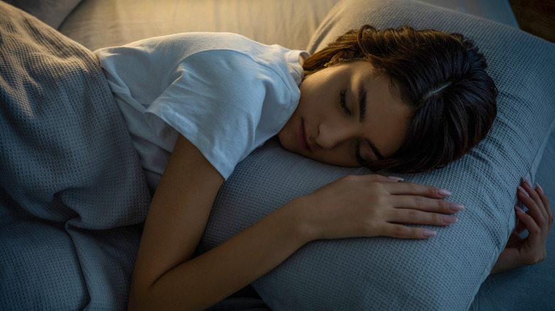 Person sleeping on pillow