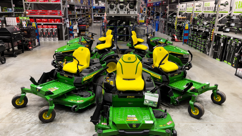 John Deere zero-turn mowers on display at a store