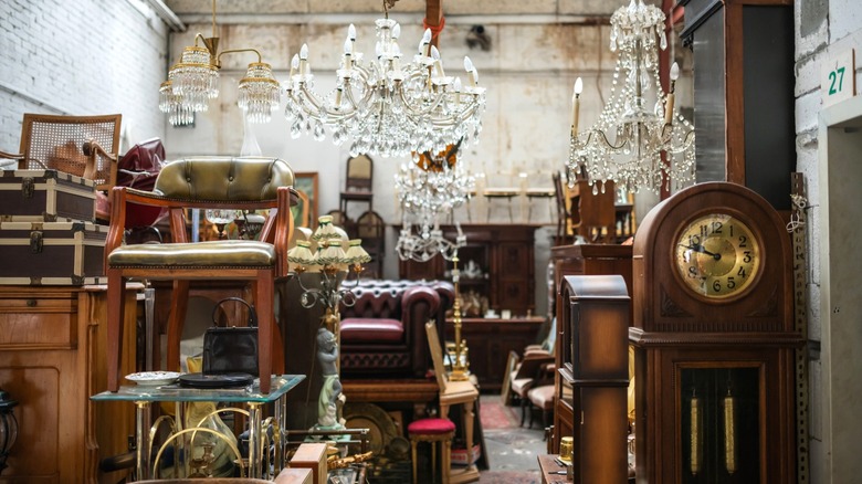 vintage furniture stacked in a thrift store