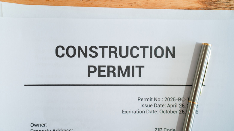 A document for a construction permit on a desk